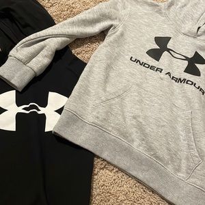 Long sleeve shirts. One gray sweater and one black long sleeve.